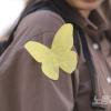-4월 13일 오후 세월호 참사 10주기 <4.16기억문화제>가 열리기 전 서울시청 앞에서 열린 사전행사에서 시민들이 노란 나비를 달고 있다.
